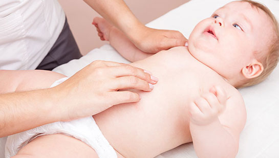 Baby receiving chiropractic adjustment to relieve colic from San Ramon chiropractor