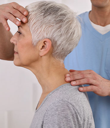 Patient receiving chiropractic adjusmtent for migraine relief from San Ramon Chiropractors