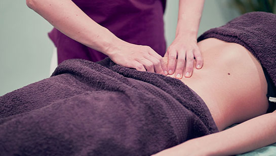 Woman receiving myofascial release for fertility from San Ramon chiropractor