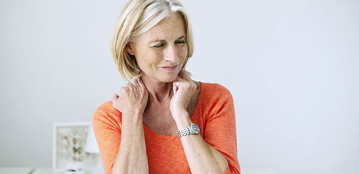 Mature woman suffering from neck and shoulder pain before visiting San Ramon chiropractor