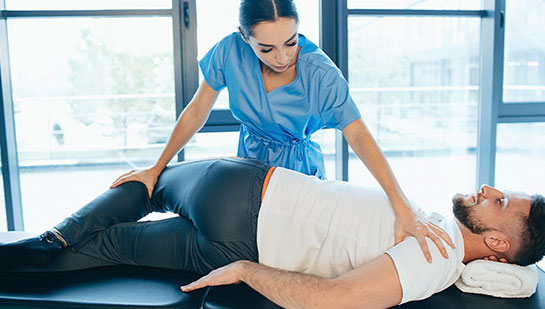 Patient receiving sciatica treatment from San Ramon chiropractor