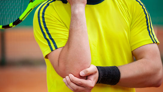 Man with tennis elbow before chiropractic treatment from San Ramon chiropractor