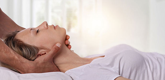 Woman receiving neck adjustment from San Ramon chiropractor