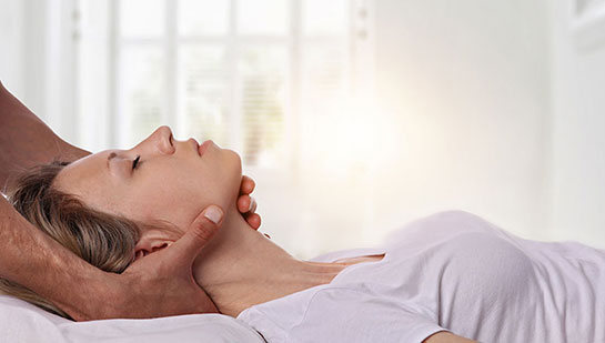 Woman receiving neck adjustment from San Ramon chiropractor