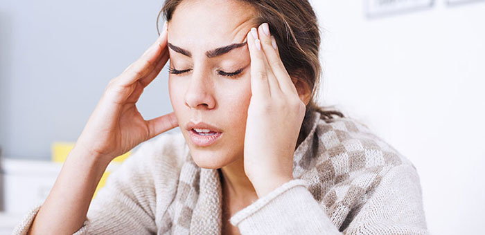Woman suffering from headache before visiting San Ramon chiropractor