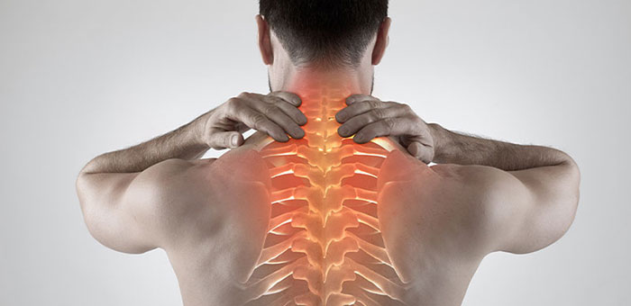 Man with upper back pain before chiropractic treatment from San Ramon chiropractor