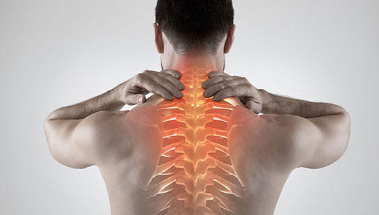 Man with upper back pain before chiropractic treatment from San Ramon chiropractor